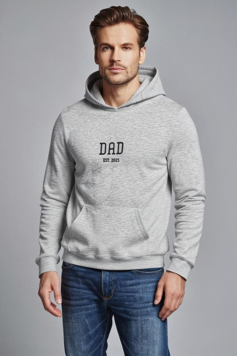 Man wearing a gray hoodie with 'DAD' text on a gray background