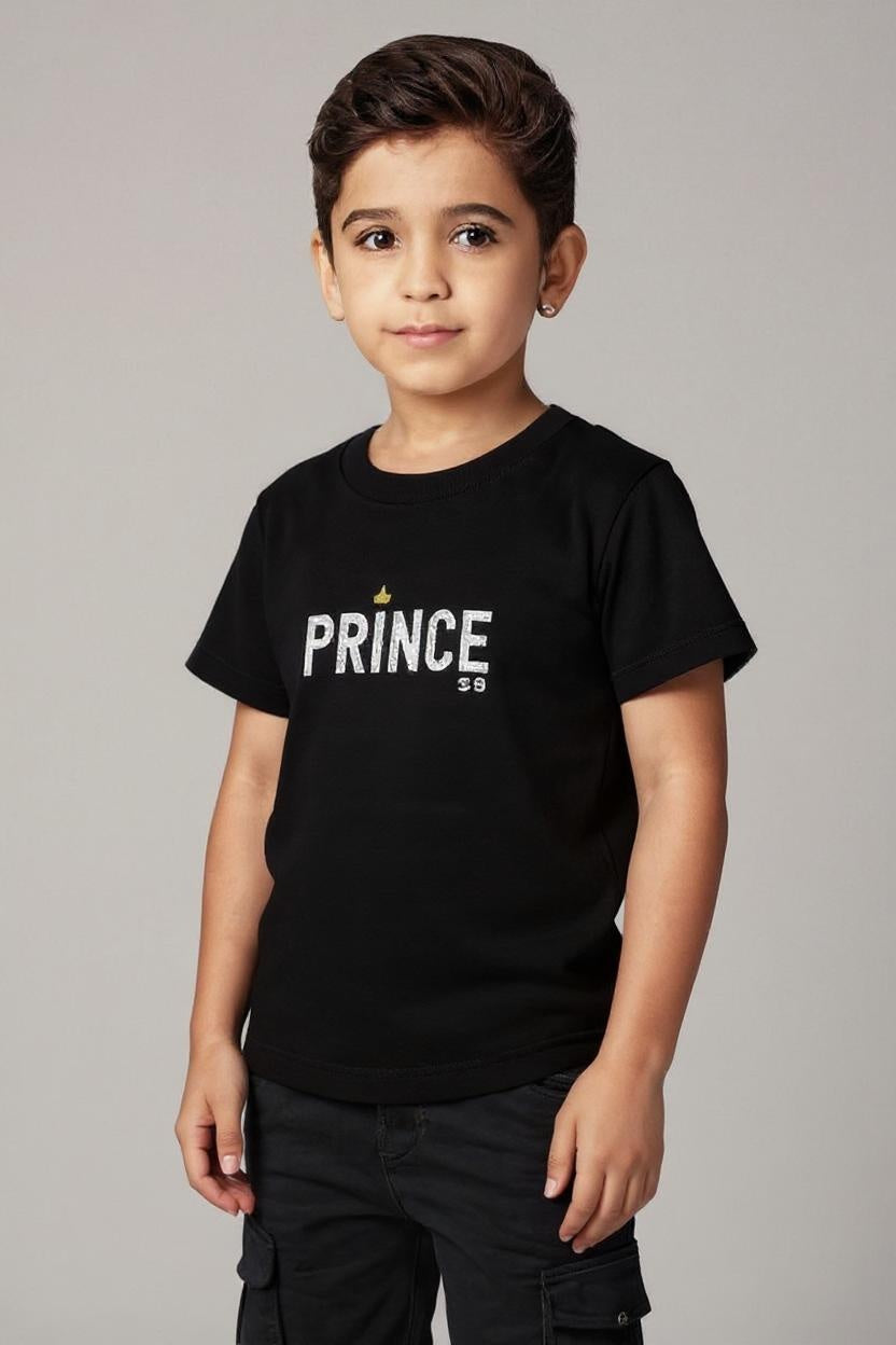 Child wearing a black t-shirt with 'PRINCE' printed on it against a plain background
