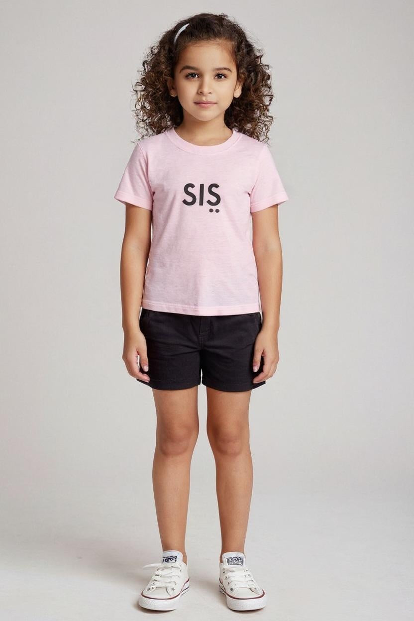 Child wearing a pink t-shirt with 'SIS' on a plain background