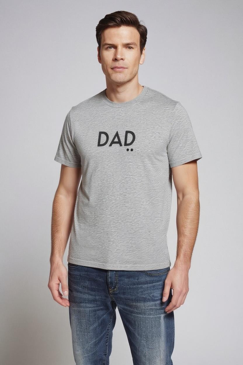 Man wearing a gray t-shirt with 'DAD' printed on it against a plain background
