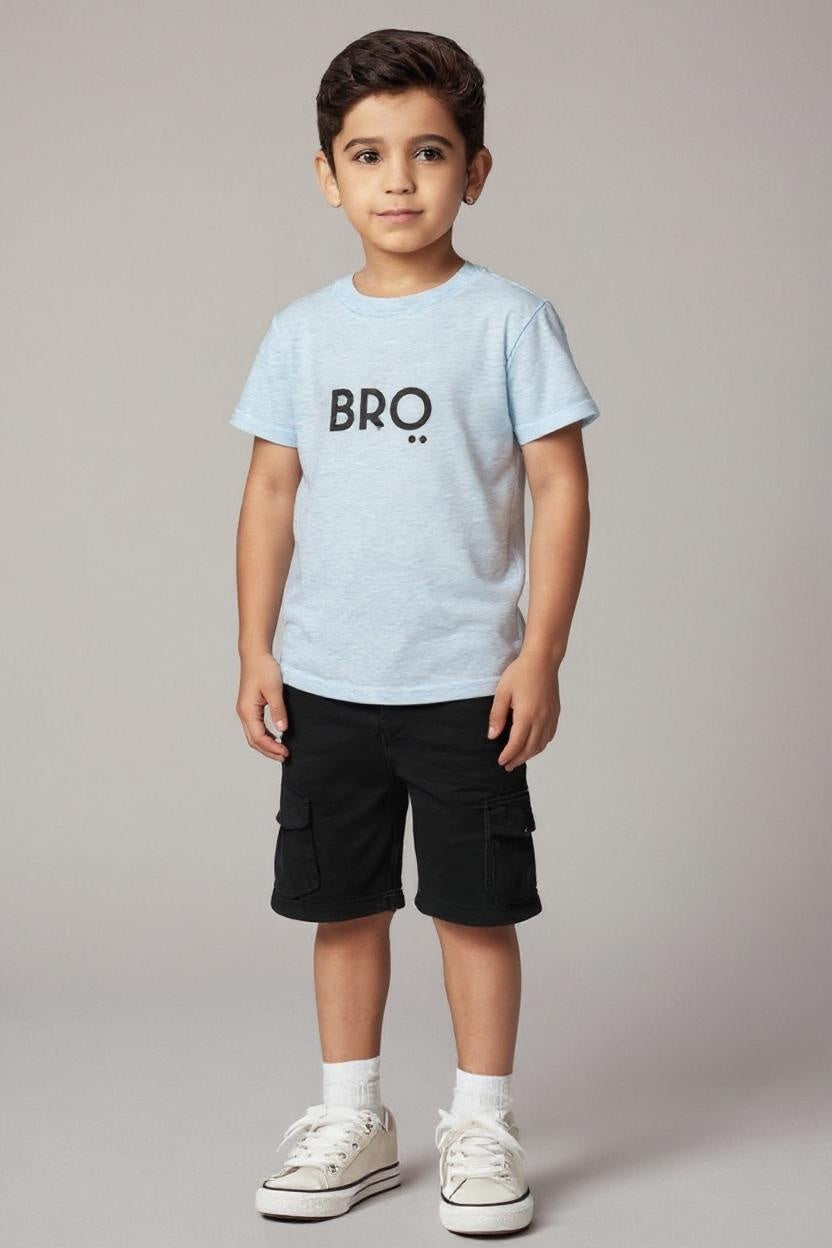 Child wearing a light blue t-shirt with 'BRO' text on a plain background