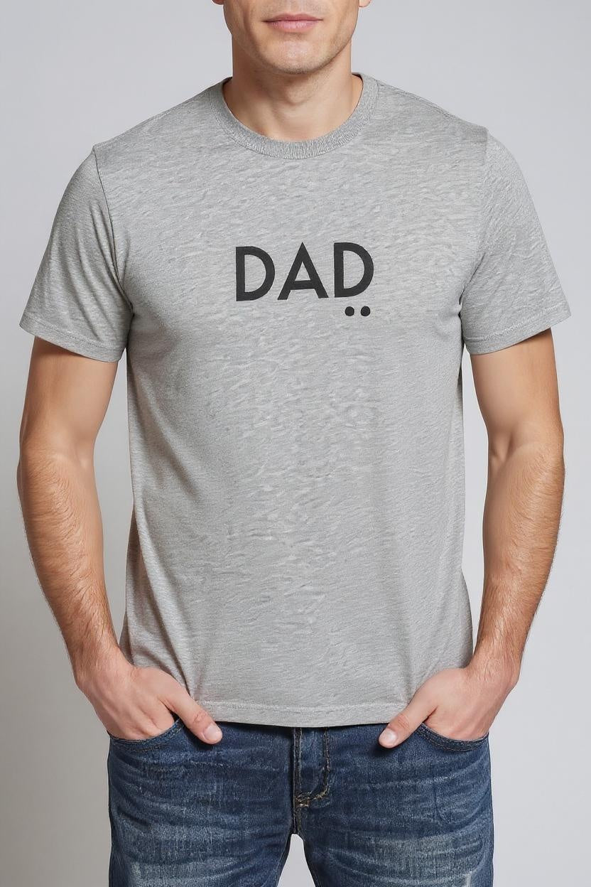 Person wearing a gray t-shirt with 'DAD' text on a plain background