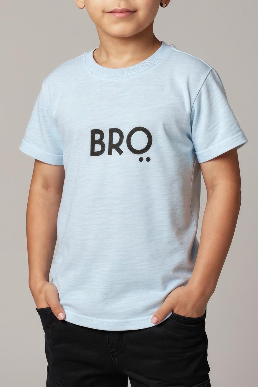 Child wearing a light blue t-shirt with 'BRO' printed on it against a neutral background