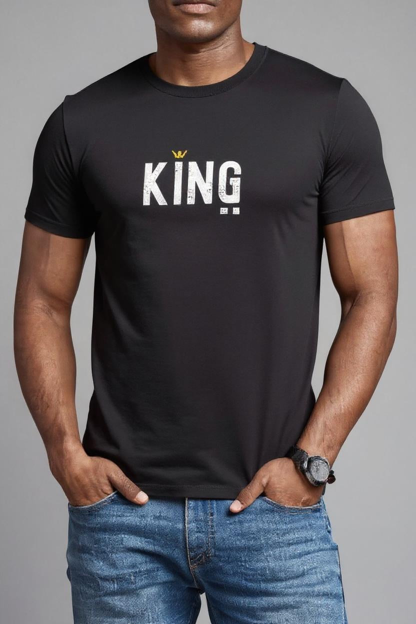 Person wearing a black t-shirt with 'KING' printed on it against a gray background