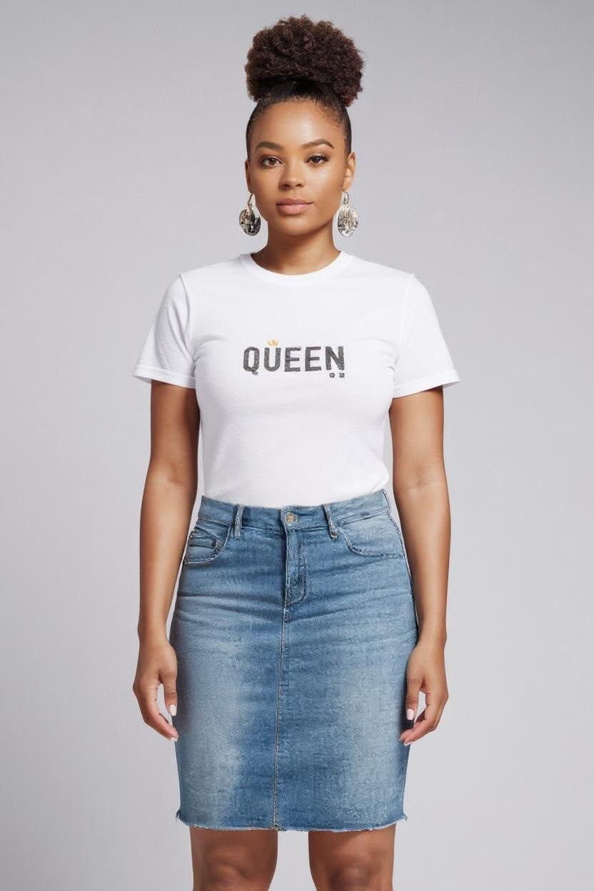 Woman wearing a white t-shirt with 'QUEEN' text and a denim skirt on a gray background