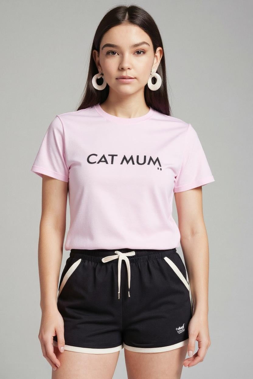 Woman wearing a pink t-shirt with 'CAT MUM' text and black shorts on a gray background