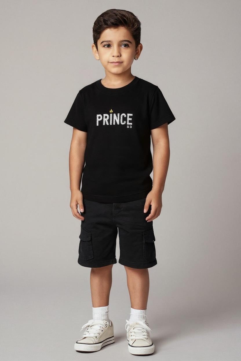 Child wearing a black t-shirt with 'PRINCE' printed on it against a plain background