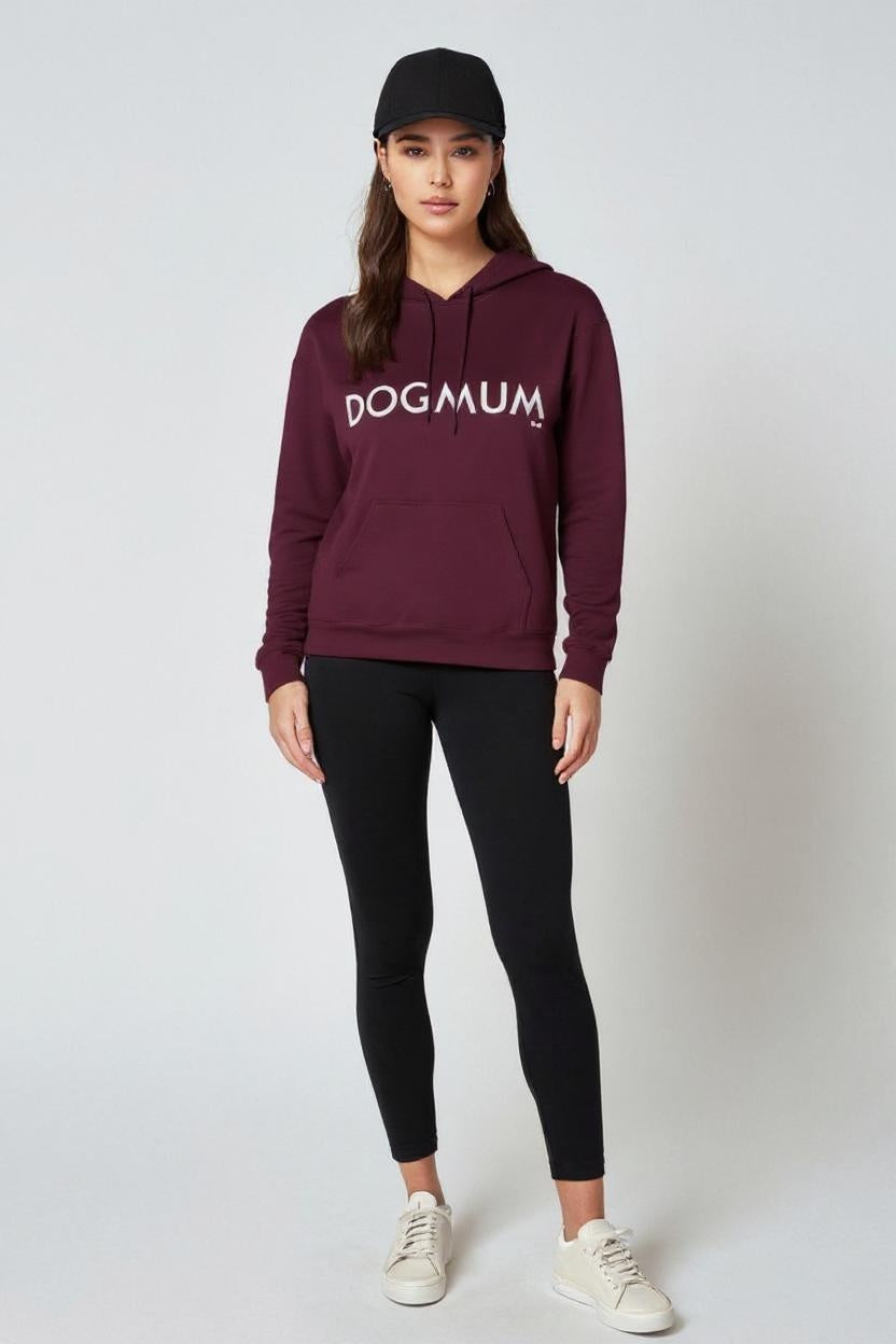 Person wearing a maroon hoodie with 'DOG mum' text, black leggings, and white sneakers on a white background