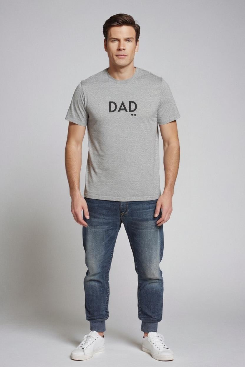 Man wearing a gray t-shirt with 'DAD' printed on it against a plain background