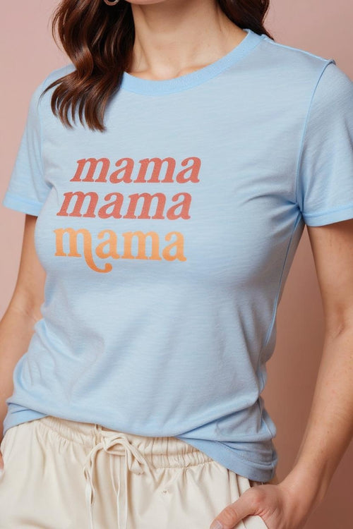 Light blue t-shirt with 'mama mama mama' text worn by a person on a beige background