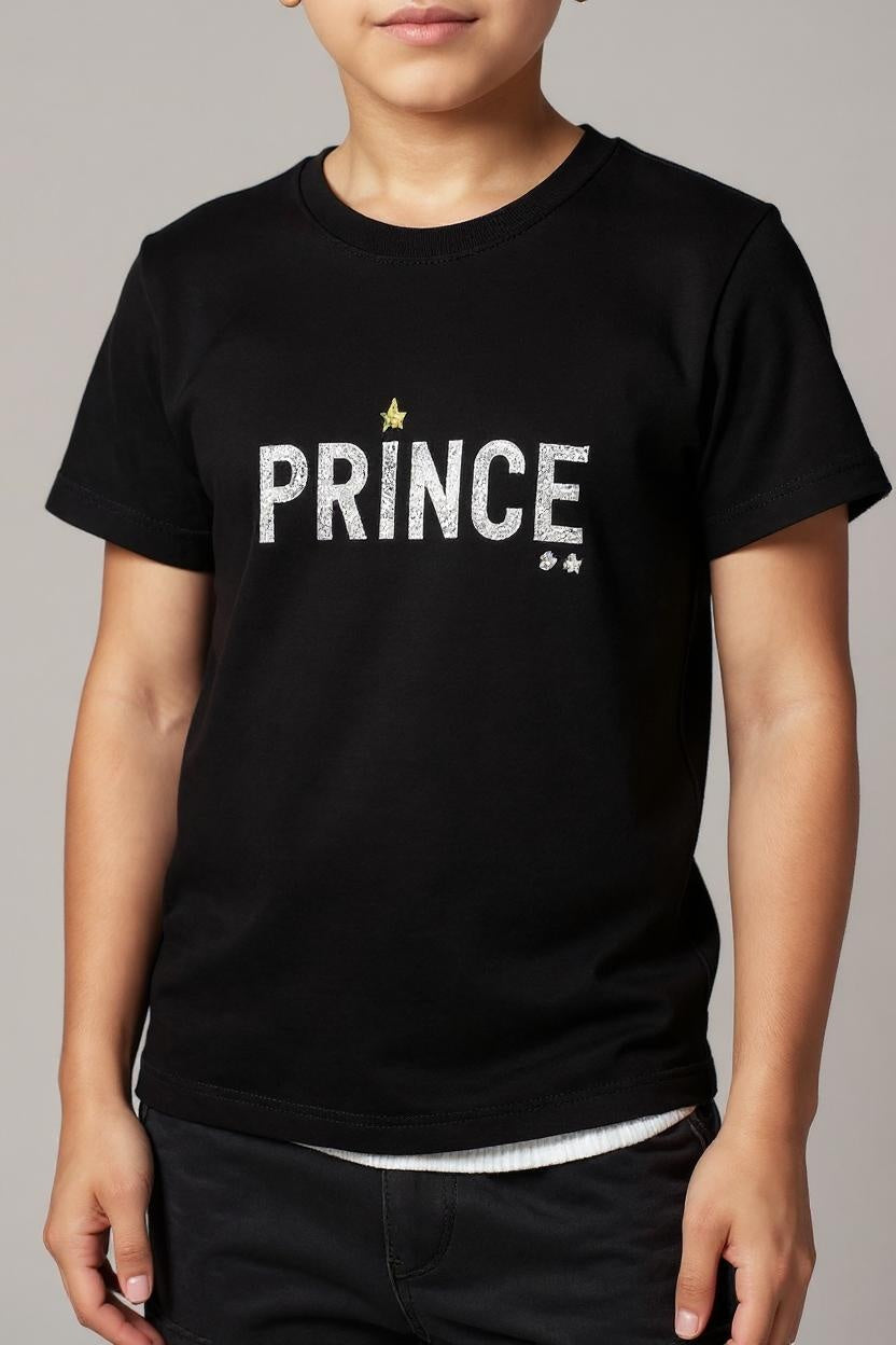 Person wearing a black t-shirt with 'PRINCE' printed on it against a gray background