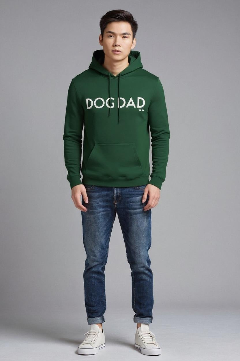 Man wearing a green hoodie with 'DOG DAD' text on a gray background