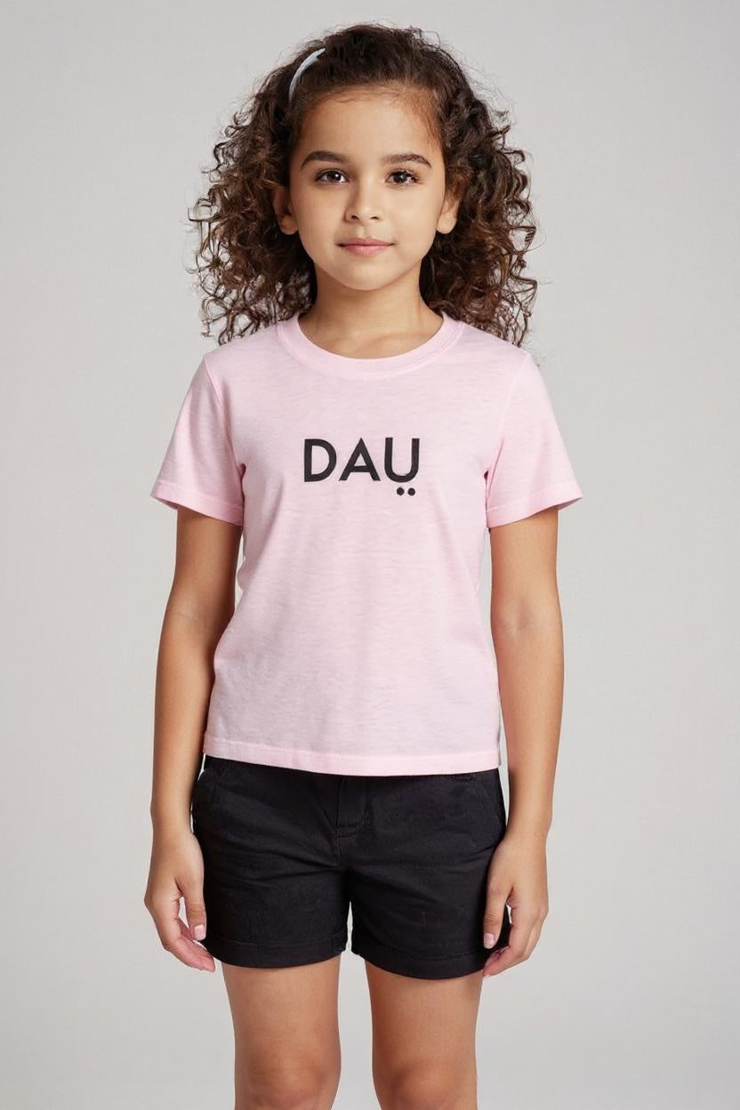 Child wearing a pink t-shirt with 'DAU' text on a plain background