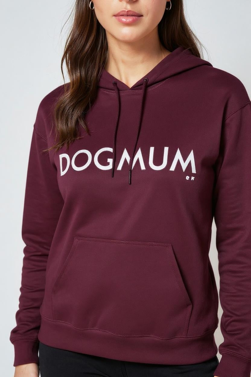 Maroon hoodie with 'DOGMUM' text worn by a person on a white background